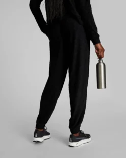 PUMA - Pantalone tuta da donna nero in tessuto traspirante