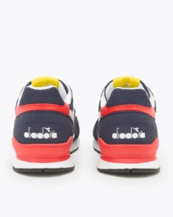 PUMA - Sneakers blu e bianca con dettagli rossi e gialli, numerata 36/39 - N 92 GS