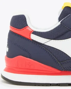PUMA - Sneakers blu e bianca con dettagli rossi e gialli, numerata 36/39 - N 92 GS