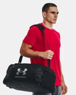 UNDER ARMOR - Borsone nero impermeabile con tasca frontale e logo bianco