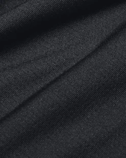 UNDER ARMOUR - Top nero ultra aderente in tessuto traspirante con logo bianco