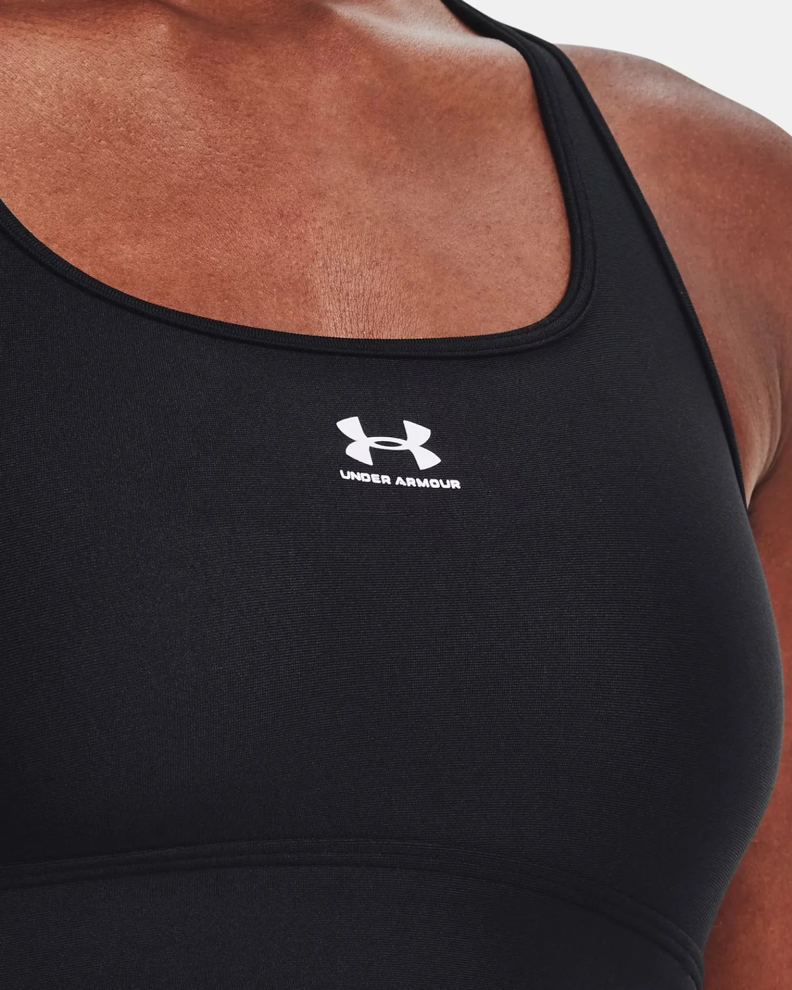 UNDER ARMOUR - Top nero ultra aderente in tessuto traspirante con logo bianco